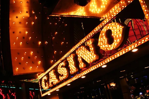 Live dealer rolling three dice during Super Sic Bo broadcast